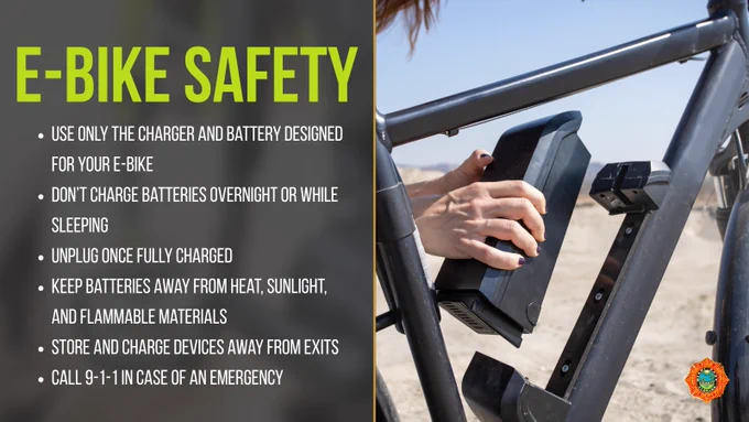 E-bike safety tips are listed next to an image of hands inserting a battery into an e-bike frame. Tips include using the correct charger, avoiding charging overnight, unplugging when charged, keeping batteries from heat and flammables, storing devices away from exits, and calling emergency services if needed.
