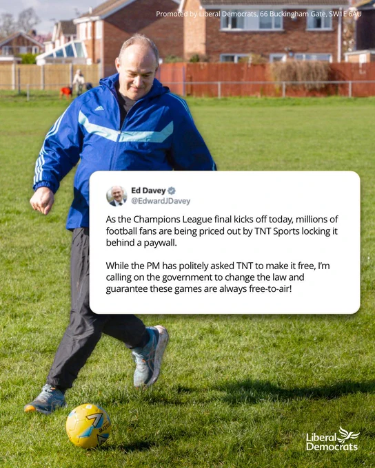 Ed Davey, leader of the Liberal Democrats, walks across a football pitch preparing to kick a yellow football. 

Overlaid on the image is a screenshot of a social media post from Ed Davey calling for Champions League finals to be shown free-to-air, arguing that football fans are being priced out by paywalls.