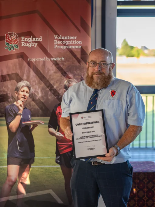 Pitcure of Graham Place with Volunteer Nomination Certificate