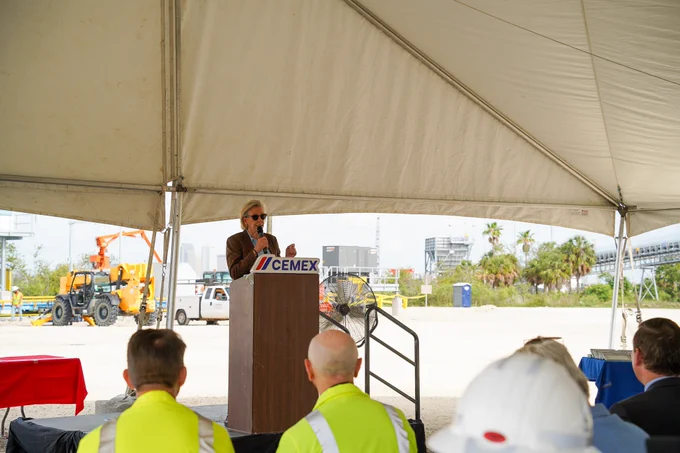 Mayor Jane Castor speaks at a podium with Cemex on it.