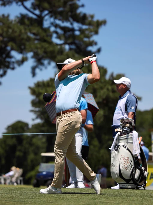 Golfers compete during the UNC Health Championship, teeing off, hitting approach shots, and putting on the course