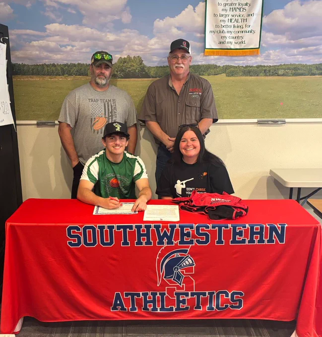 Seated: Tucker Branson and Megan Branson. Standing: Brad Branson and Mark Johnson, Southwestern sports shooting coach.