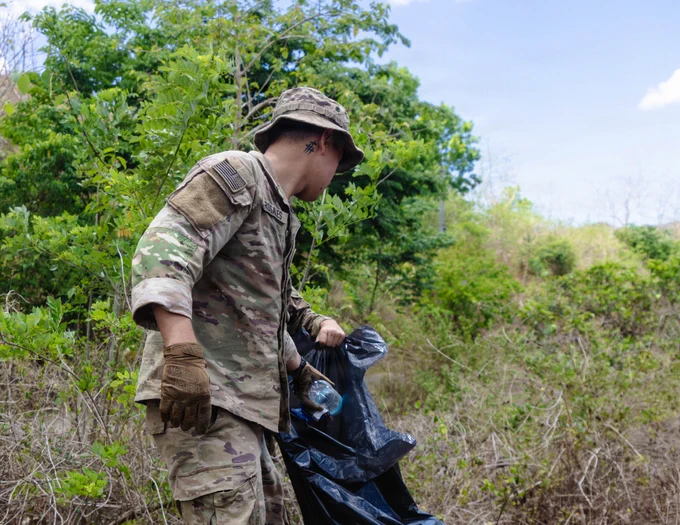 A U.S. Soldier assigned to 3rd Mobile Brigade, 25th Infantry Division, conducts a post-exercise cleanup effort to restore the training area during a post-exercise cleanup effort as part of Joint Pacific Multinational Readiness Center Exportable Exercise at Laur, Philippines, May 21, 2026.