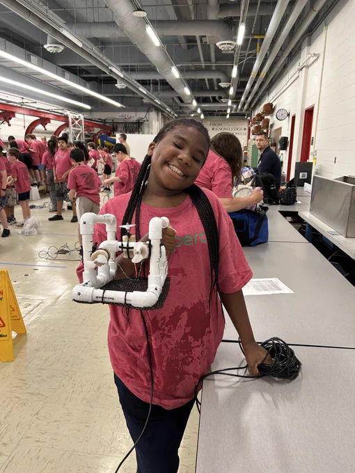 Proud 5th grade engineer shows her self-built ROV.