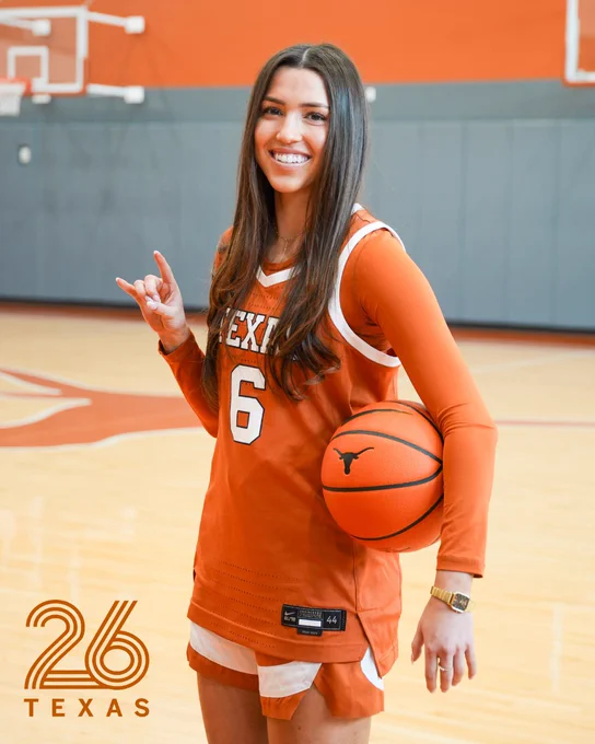 Sarah Graves holds up a hook 'em in her basketball uniform. The UT Class of 2026 logo is seen at the bottom left of the photo. 