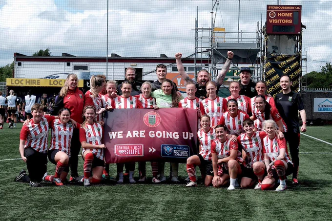 Bishopton players hold a banner that says 'we are going up'
