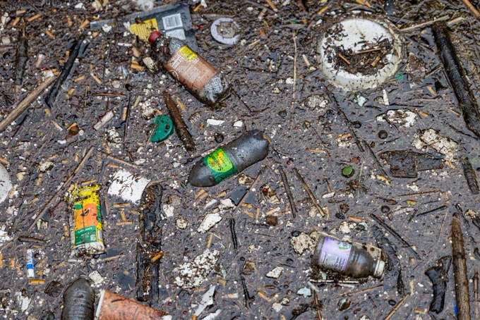 Plastic and other trash collected by a boom along a creek that drains into Lake Erie, May 1, 2026, in Erie, Pennsylvania. (Brian Cassella/Chicago Tribune)
