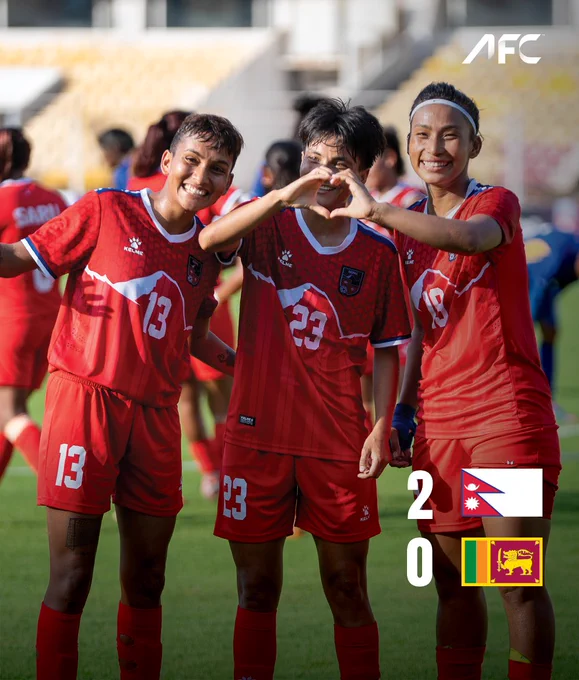 Three women football players celebrating after a win, wearing red uniforms with a match score overlay. Joyful and energetic mood.