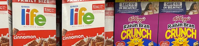 Breakfast cereal boxes on a grocery shelf