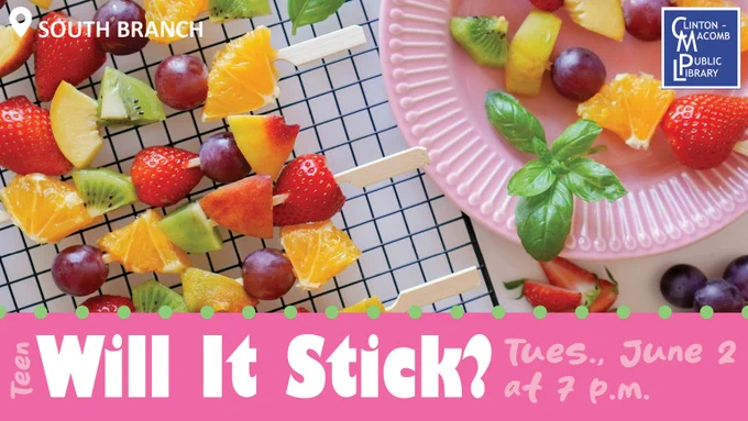 Vibrant fruit kabobs featuring strawberries, grapes, kiwi, and orange segments laid out on a grid with a pink plate holding additional fruit and basil garnish.