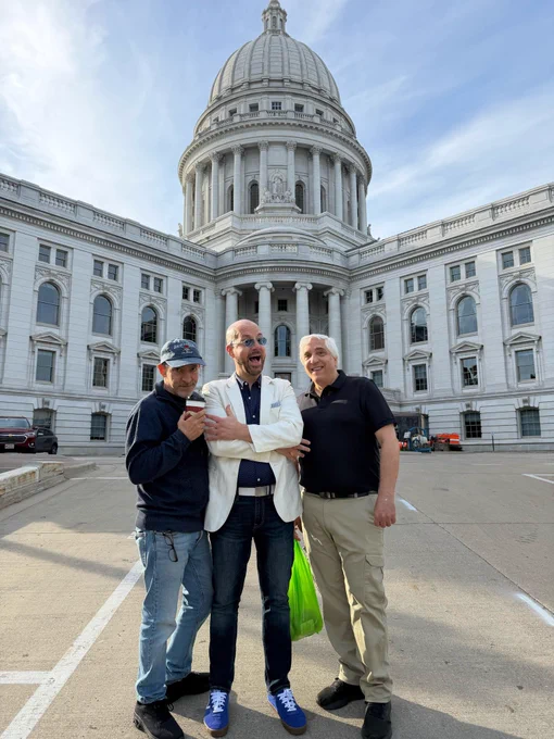 George, Steve, and Bob in front of a white domed building 