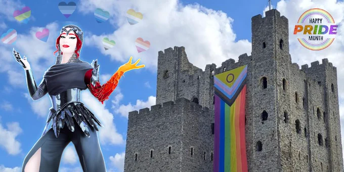Phea Nox (The Coach from Good Luck Babe) from Just Dance 2026 in in front of Medway Castle with a pride flag on it outdoors, midday. "Happy Pride Month" is in the top right corner.