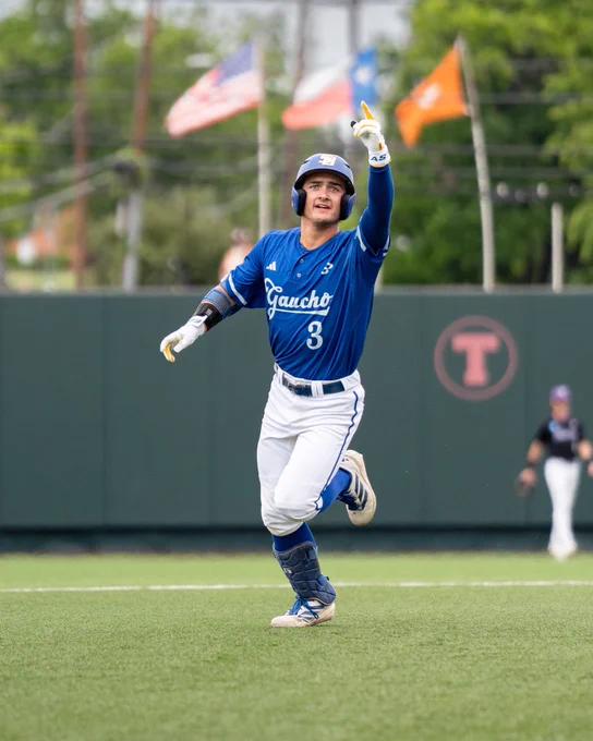 Rowan Kelly pointing up to the stands after hitting a home run.