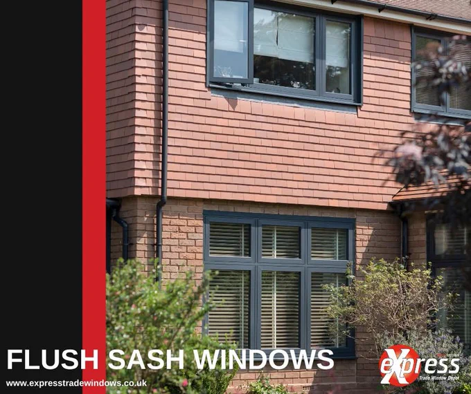 Exterior view of a modern house featuring stylish flush sash windows. The image showcases architectural design with a focus on window aesthetics.