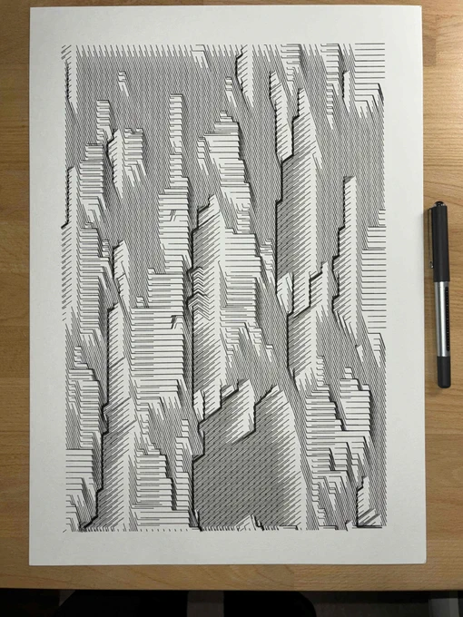 Intricate black line patterns creating an abstract geometric landscape on white paper, placed on a wooden surface.