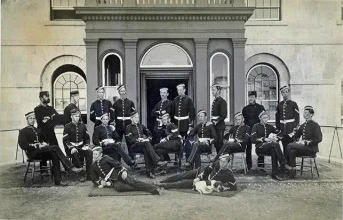 Black and white photo of a group of people in military uniform.