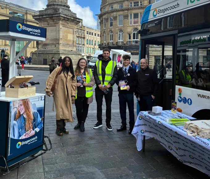 Bus Users UK with representatives from Stagecoach North East in the centre of Newcastle with the Stagecoach trike and an electric bus