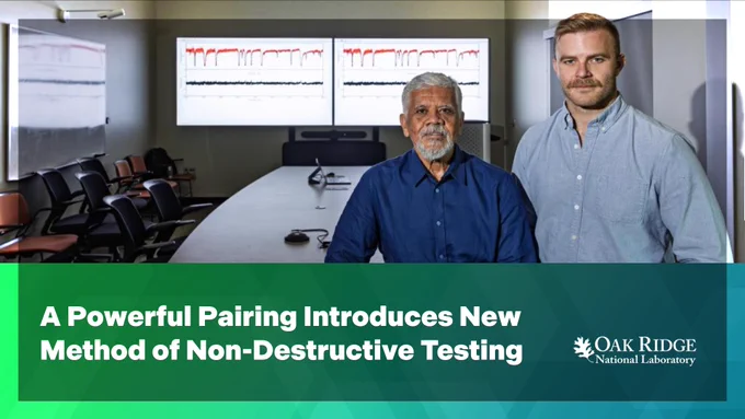The image shows two individuals standing in a conference room with a large screen displaying graph data. Text on the image reads: "A Powerful Pairing Introduces New Method of Non-Destructive Testing"