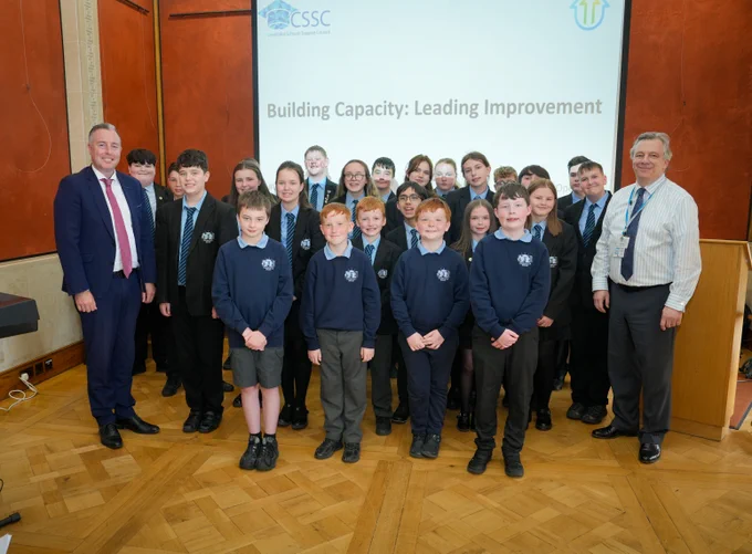 Paul Givan, Education Minister; Thornfield House School choir and Mark Baker, Chief Executive, CSSC.
