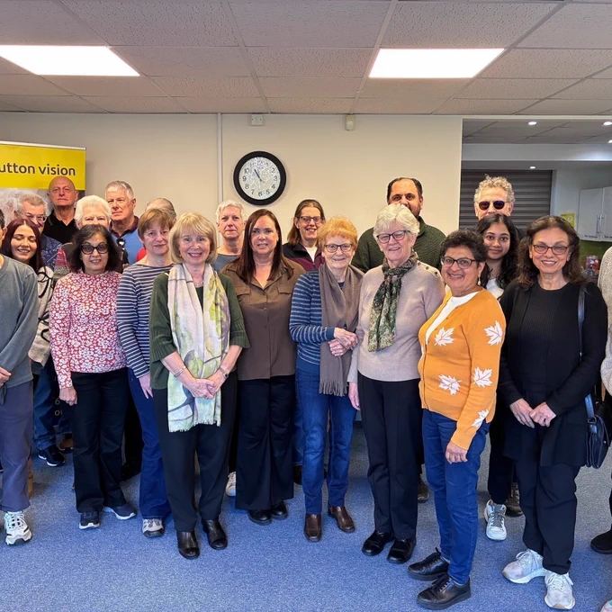 Photo shows our volunteers smiling in our offices