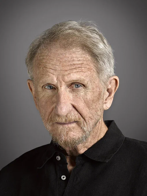 Professional headshot of René Murat Auberjonois. 