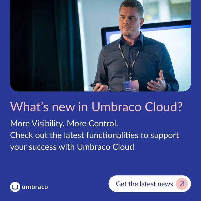 A man named Arnold Visser speaks during a presentation while wearing a dark blue button-down shirt and an Umbraco Partner Summit badge lanyard. He holds a wireless presenter remote in one hand and gestures with the other in front of a bright display screen.