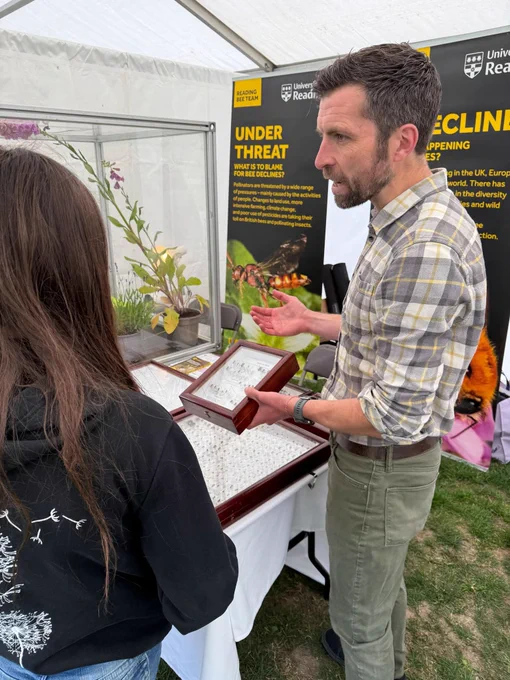Professor Mike Garratt, presenting an entomology specimen display case to a visitor at the University of Reading’s Centenary Community Festival.