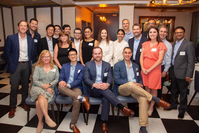 A group photo of 20 people, including DCRI fellows, their mentors, and program staff.