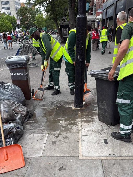 Street cleaning officers sweeping and cleaning rubbish off the streets