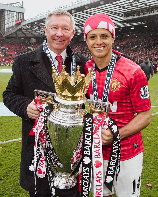 Chicharito and Sir Alex Ferguson celebrating winning the Premier League.