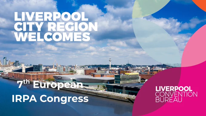 Panoramic view of Liverpool waterfront on a bright, partly cloudy day, showing the River Mersey in the foreground and city landmarks such as the Exhibition Centre, Albert Dock warehouses, ferris wheel, cranes, and the Radio City tower in the skyline. Large white text reads “Liverpool City Region Welcomes 7th European IRPA Congress.” Colourful abstract shapes appear on the right, alongside the “Liverpool Convention Bureau” logo.
