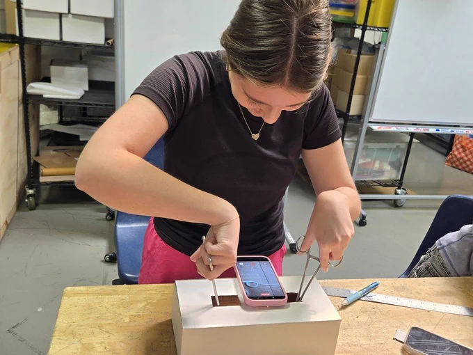 Student modeling laparoscopic surgery.