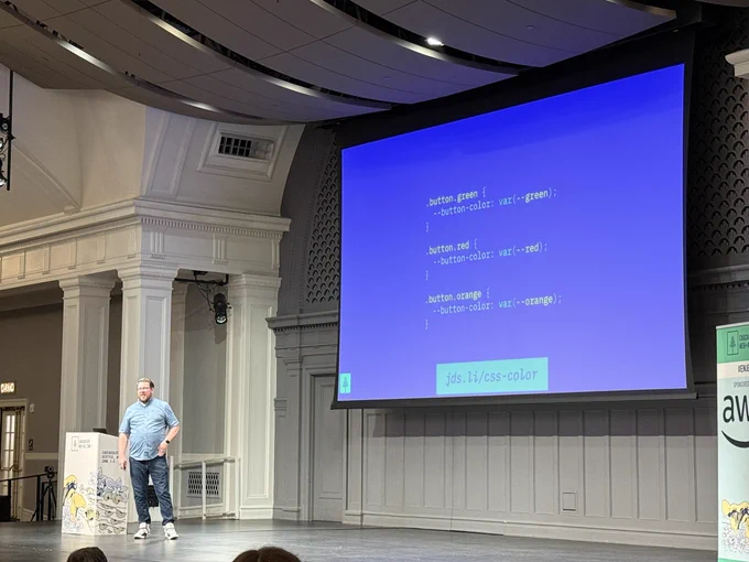 James presenting on stage