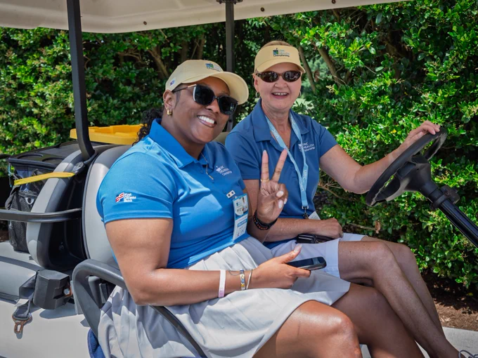 Volunteers perform various tasks throughout the UNC Health Championship, including greeting guests, assisting with operations, providing directions, and supporting activities across the course