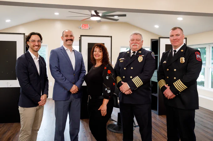 Speakers stand together at the event, representing the Pennsylvania Insurance Department, Pennsylvania Office of the State Fire Commissioner, IA&B, Lower Paxton Township Bureau of Fire, and Color Bar Beauty Salon. 