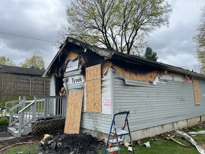 The exterior of the Color Bar Beauty Salon building after a fire.