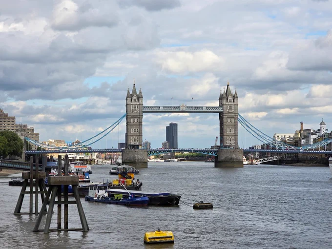 Tower Bridge on a partially cloudy day.