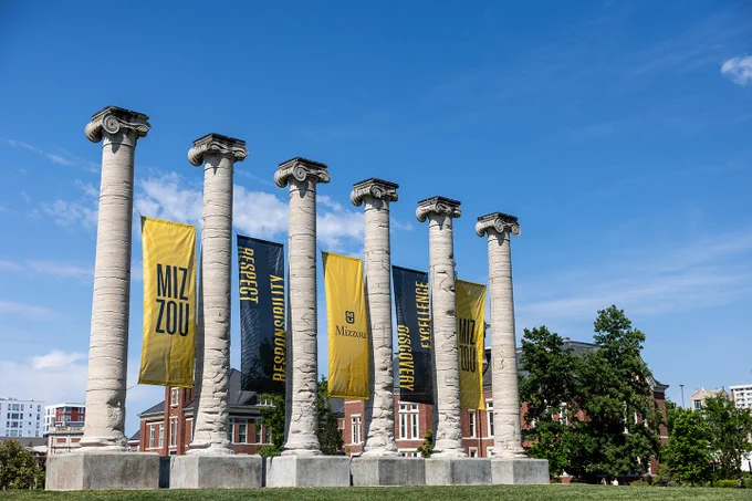 The Columns with black & gold banners.