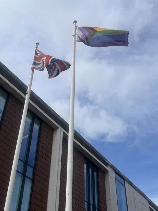 Union Jack and Pride flag flying outsie the Forum.