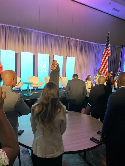 An Honor Guard and Bagpipes Troupe, as well as FLL's Terminal Tunes vocalist Taylor Babineaux, perform during the opening ceremony of the Airports Conference of the Americas.