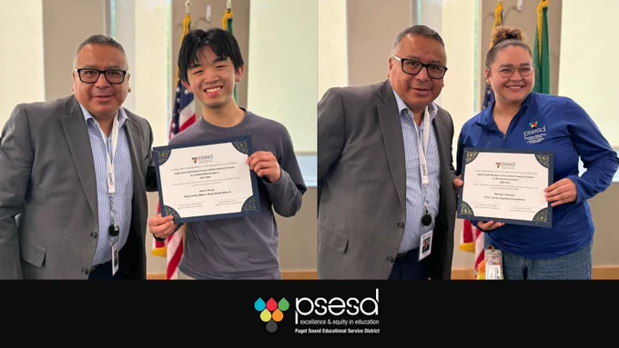A male superintendent poses with a young male and female student, each holding an award certificate.
