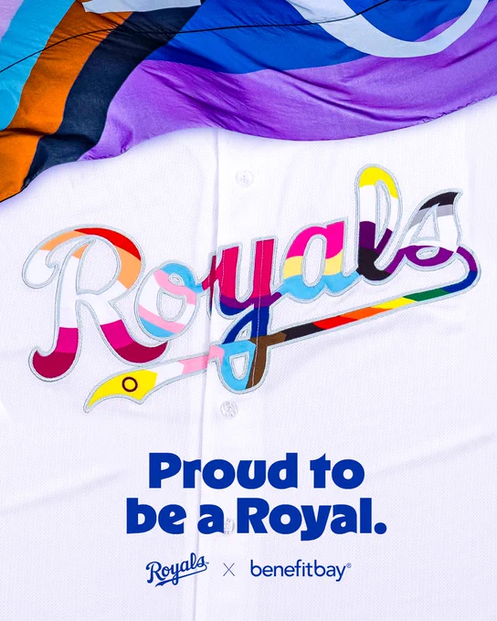 A Royals jersey with Pride colors and the Pride flag incorporated into it. Text on the graphic reads, "Proud to be a Royal" "Royals x benefitbay"