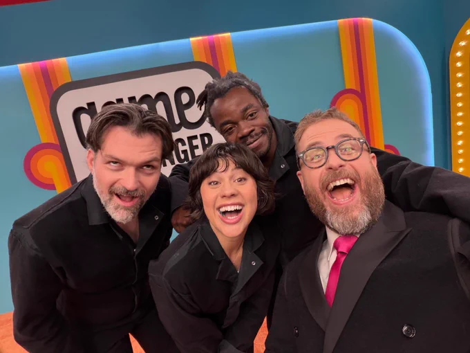 Sam Reich taking a set selfie with contestants Josh Ruben, Anna Garcia, and Demi Adejuyigbe.