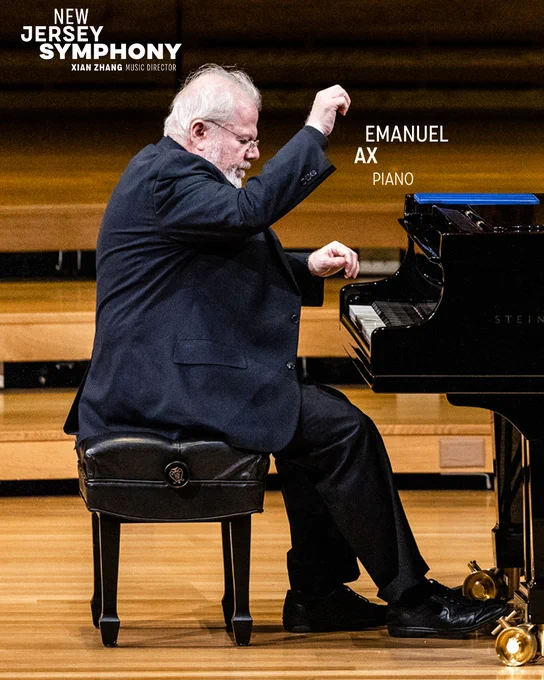 Emanuel Ax playing a piano solo on stage.