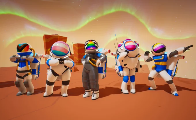 A screenshot of several different Astroneers posing on a planet. They are each wearing a different pride visor. 