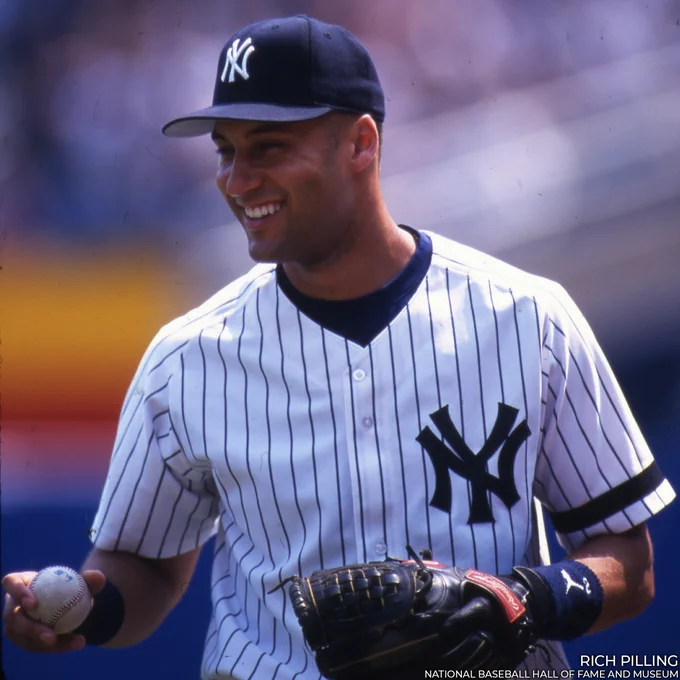 Derek Jeter smiles wearing a home pinstripe Yankees uniform. (Rich Pilling/National Baseball Hall of Fame and Museum)