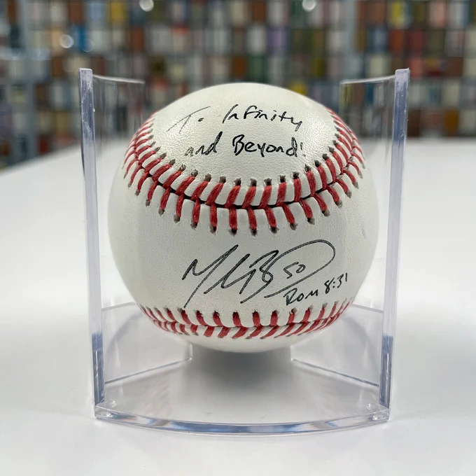 A close-up shot of a baseball signed by Mookie Betts