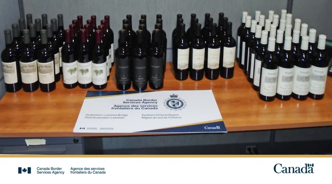 72 bottles of wine on a table.