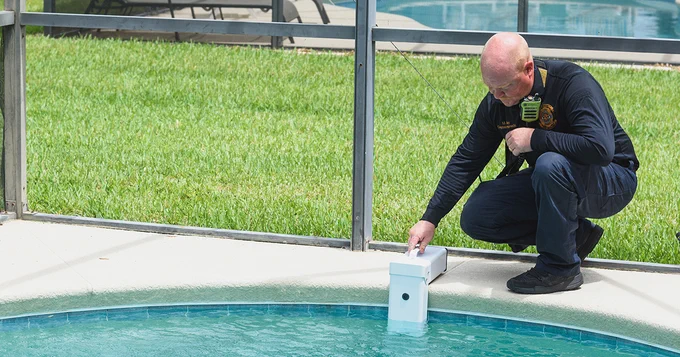 PCFR member installing a pool alarm in a resident’s pools.