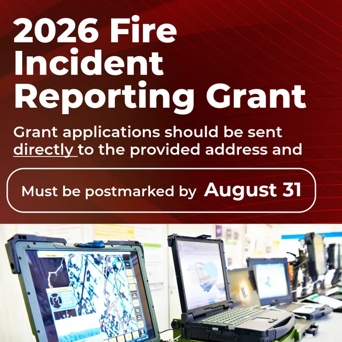 A promotional image for the 2026 Fire Incident Reporting Grant. It states that grant applications should be sent directly to the provided address and must be postmarked by August 31. The background shows multiple open laptops on a table.